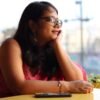 Indian woman resting her chin on her hand, lost in thought, representing overthinking counselling